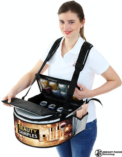 Hawkers tray used for organic drink sampling and brand message delivery at outdoor festival to increase purchase impulses.