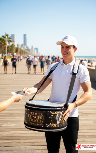 Chicago open-air concert hawker’s tray enabling drink enjoyment and brand message promotion during live event marketing.