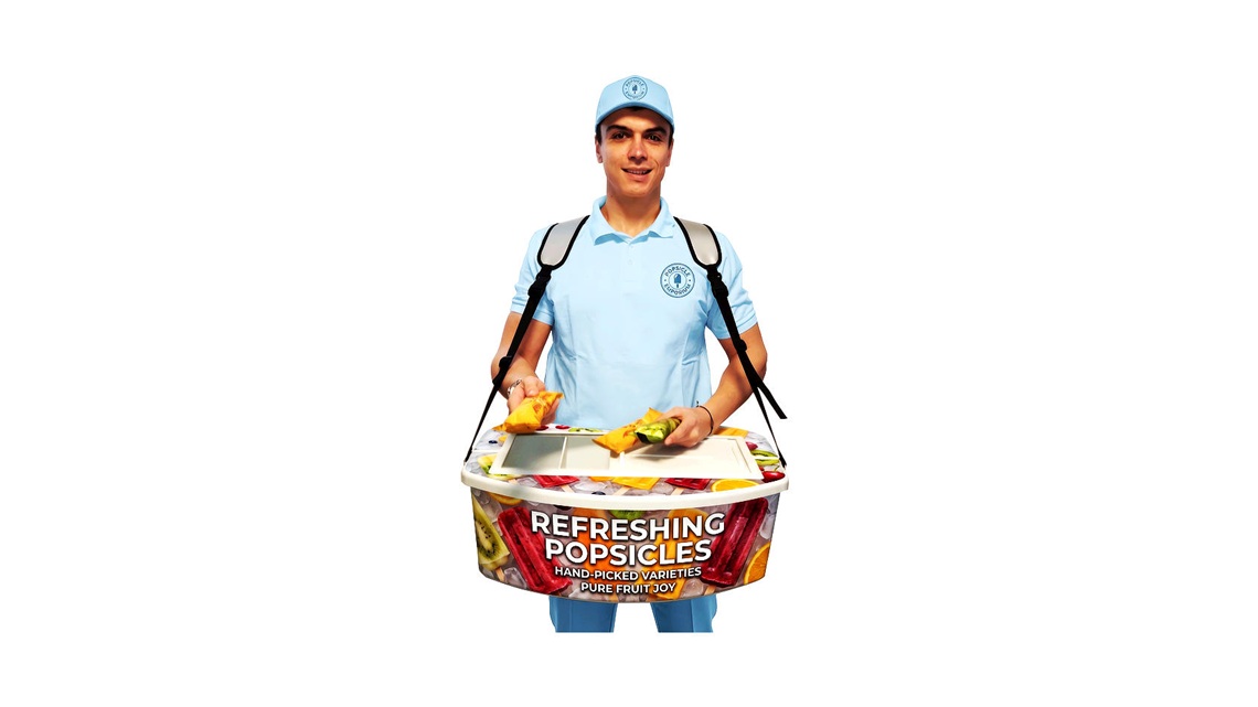 Promoter in action, flexibly selling products and refreshments directly from a professional vending belly tray.